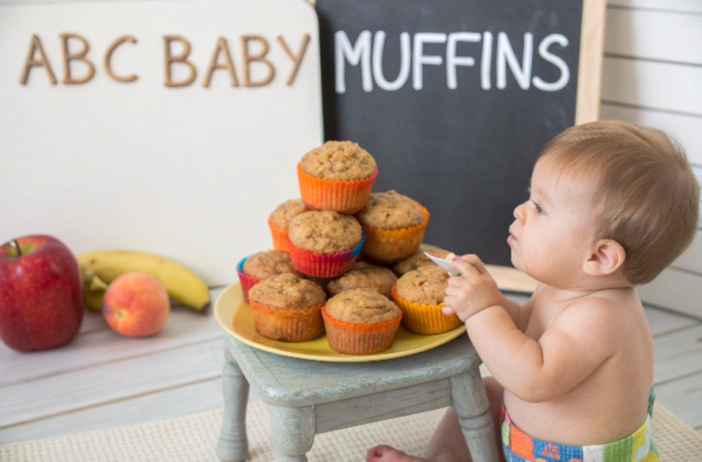 Essential ingredients for ABC muffins arranged on a kitchen counter